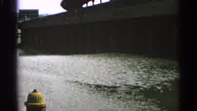 Minnesota USA (1965): Water Flowing Under A Bridge Can Be Seen Then Changes To