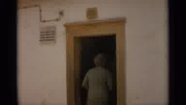 NAZARE PORTUGAL-1965: Person Enters White Building
