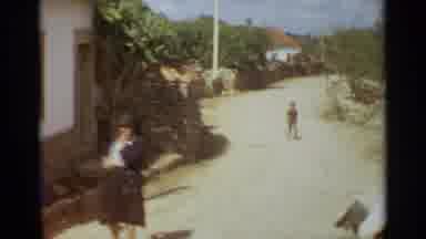 NAZARE PORTUGAL-1965: Young Women In Traditional Dress And Historic Cloister