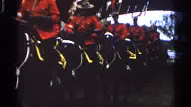 Saint Louis Missouri-1965: A Line of Rcmp Officers in Red Serge Ride Horses in Formation