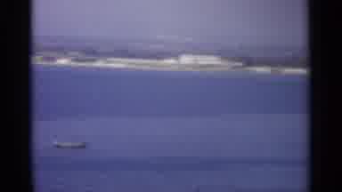Sicily-1965: Panoramic Scan Of Far Away Harbor Shore With A Short Close Up Of A Sailboat