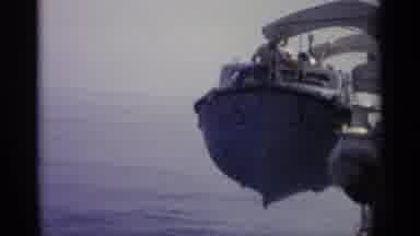 Sicily-1965: A Boat Being Lowered Into The Water About To Set Sail