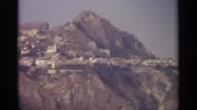 Sicily-1965: Vintage Hillside Village With Rocky Terrain And White Buildings