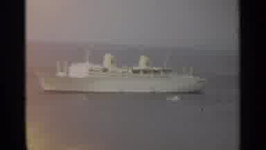 STOCKHOLM SWEDEN-1965: A Cruise Ship At Sea And Motorboat Docking At Harbor