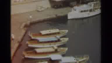 STOCKHOLM SWEDEN-1965: Footage Showcasing Different Types Of Boats Docked At A