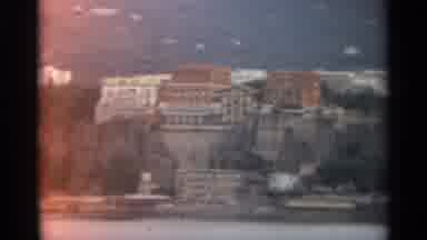 STOCKHOLM SWEDEN-1965: Buildings On A Cliffside Overlooking A Large Body Of Water