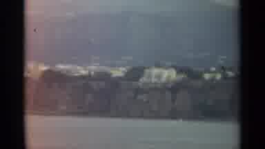 STOCKHOLM SWEDEN-1965: Coastal Town With Buildings On Cliffside From Water