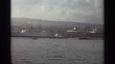 STOCKHOLM SWEDEN-1965: Ships In Port Along The Waterfront With City Skyline