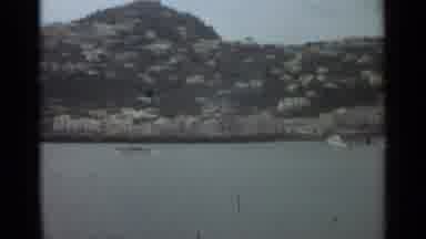 Stockholm Sweden (1965): White Boats On A Lake With Green Mountains And Houses In