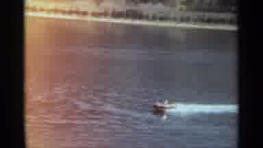 STOCKHOLM SWEDEN-1965: Speedboat Racing Across River With Wake