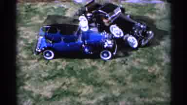 Hamel Minnesota (1966): Two Remotely Controlled Cars Turn In Circles Next To Each