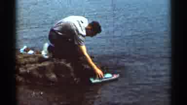 Hamel Minnesota (1966): Man Waterside Playing With A Miniature Lifelike Boat On A