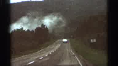 Hamel Minnesota (1966): Driving Down A Long Road Beside An Active Forest Fire