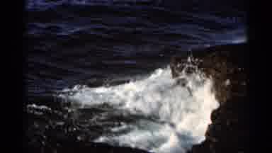 Hamel Minnesota (1966): Water Of Sea Crashing On Edge Of Cliff And Green Area