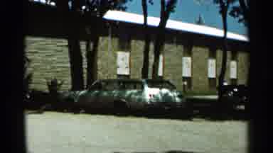 Hamel Minnesota (1966): Brick Apartment Building With Vehicles Outside Of It And A