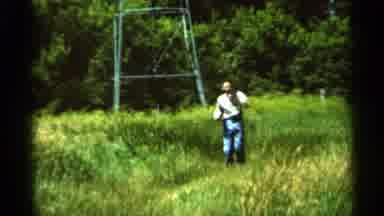 Hamel Minnesota (1966): Turquoise Car Parked In Tall Grass On A Bright Sunny Day