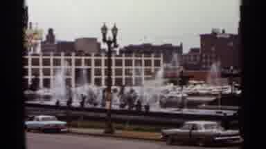 Saint Louis Missouri (1966): Fountains Next To Street Lights And Small Red Bus On