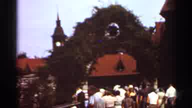 Saint Louis Missouri (1966): A Bunch Of People Walking Underneath A Green Arch