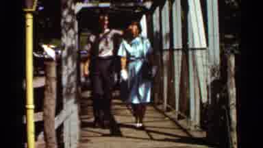 Saint Louis Missouri (1966): Two Elderly People Walking Across A Bridge Together