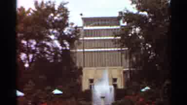 Saint Louis Missouri (1966): A Tiered Water Fountain Sprays Water In A Pool In