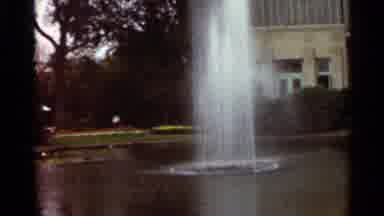 Saint Louis Missouri (1966): Man Water Fountain Clock Statue Building Trees Grass