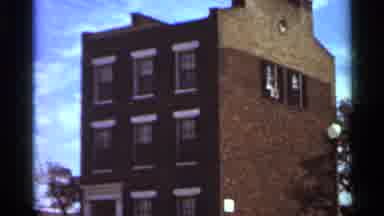 Saint Louis Missouri (1966): A Tall Brick Building That Has Seven Windows On It