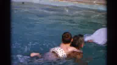 US Virgin Islands (1966): Parent Teaching Kids How To Swim While Another Kid Jumps