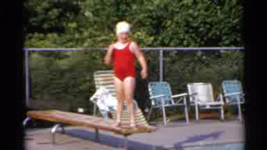 US Virgin Islands (1966): Little Girl Prepares To Jump Off Diving Board Into Pool