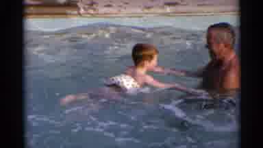 US Virgin Islands (1966): Older Man In Pool Guiding Holding Hands Young Boy In