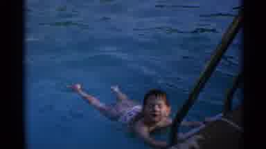 US Virgin Islands (1966): Small Boy Child Floating In Pool By Holding Ladder Women