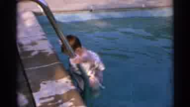US Virgin Islands (1966): A Little Girl Crawling Out Of The Pool With Her Floats