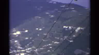 US Virgin Islands (1967): Green Mountains And Blue Towering Object On A Sunny Day