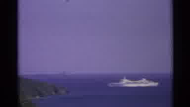 US Virgin Islands (1967): A Boat Going Away In The Sea Between Two Land Inlet