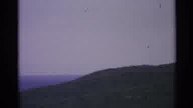 US Virgin Islands (1967): A Tall Hill Covered In Greenery Surrounded By A Body Of