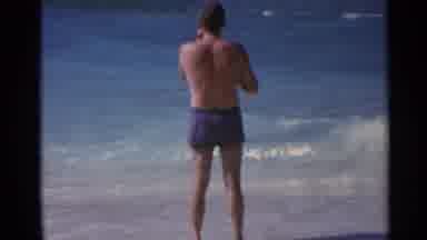 US Virgin Islands (1967): A Man Standing By The Ocean And Looking Around At Other