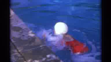 US Virgin Islands (1967): A Young Person Swims In A Body Of Water Next To A