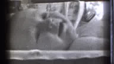 Danielson Connecticut (1939): Baby Laying In Bed Looking Around With Curiosity