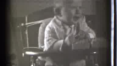 Danielson Connecticut (1939): A Young Baby Playing With A Toy And Making Himself