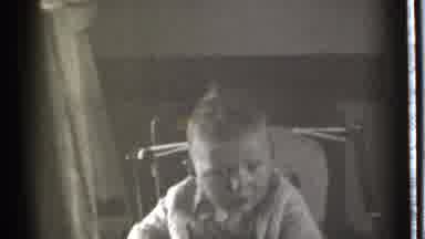 Danielson Connecticut (1939): Little Kid On Child Chair Playing In Front Of The