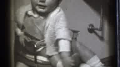 Danielson Connecticut (1939): Young Baby Sitting In A High Chair Playing With