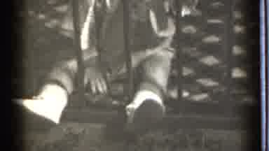 Danielson Connecticut (1939): Young Child Squishing And Pulling Fabric While
