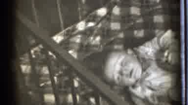 Danielson Connecticut (1939): Vintage Movie Mother Comforting Crying Baby Laying