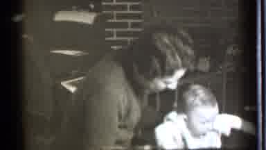 Danielson Connecticut (1939): Black And White Scene Of A Young Mom Playing With