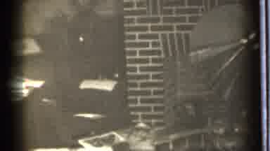 Danielson Connecticut (1939): Person Sitting Next To An Indoor Brick Fireplace