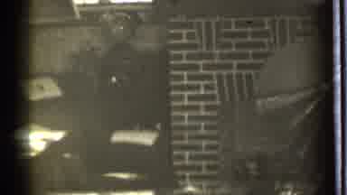 Danielson Connecticut (1939): A Man In A Room With A Red Brick Fireplace Snapping