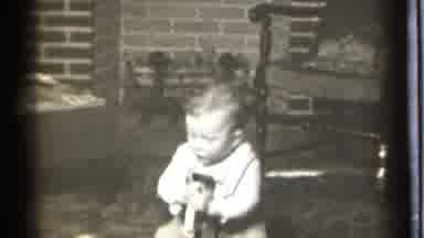 Danielson Connecticut (1939): Baby Play Toy Black White Movie Cute Beside Chair