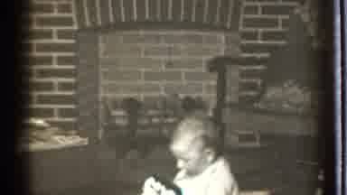 Danielson Connecticut (1939): Kid Dressed In White Playing Alone In The House In
