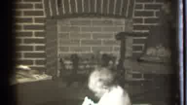 Danielson Connecticut (1939): Baby Is Sitting On The Floor Near A Fireplace And