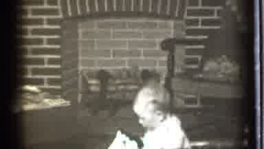 Danielson Connecticut (1939): Little Baby Sitting On His Toy In Front Of A