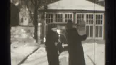 Danielson Connecticut (1939): People Wearing Black Coats Walk Towards Parked Car